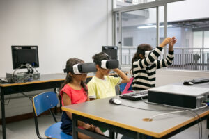 Cute multiethnic kids learning to use virtual reality glasses Cute multiethnic kids learning to use virtual reality glasses